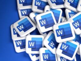 Logos of the Microsoft Office component Word on a heap. Copy space. Web banner format.