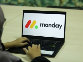 monday logo on a laptop screen.