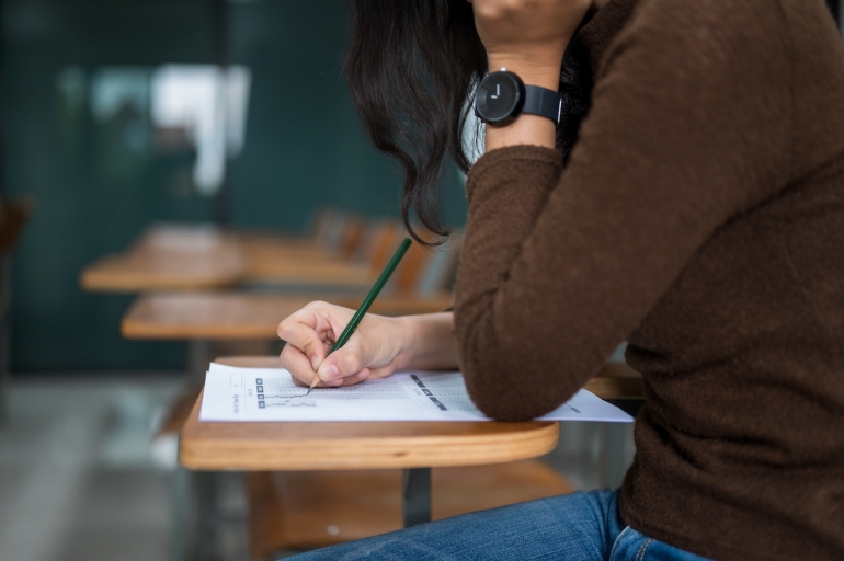 Female students taking tests at the university